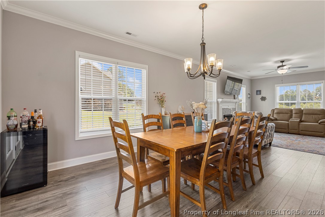137 Minter School Road Sanford, NC 27332 - Photo 13 of 50 a view of a dining room with furniture window and wooden floor