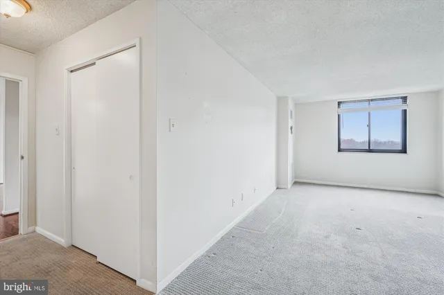 a view of a room that has a large window