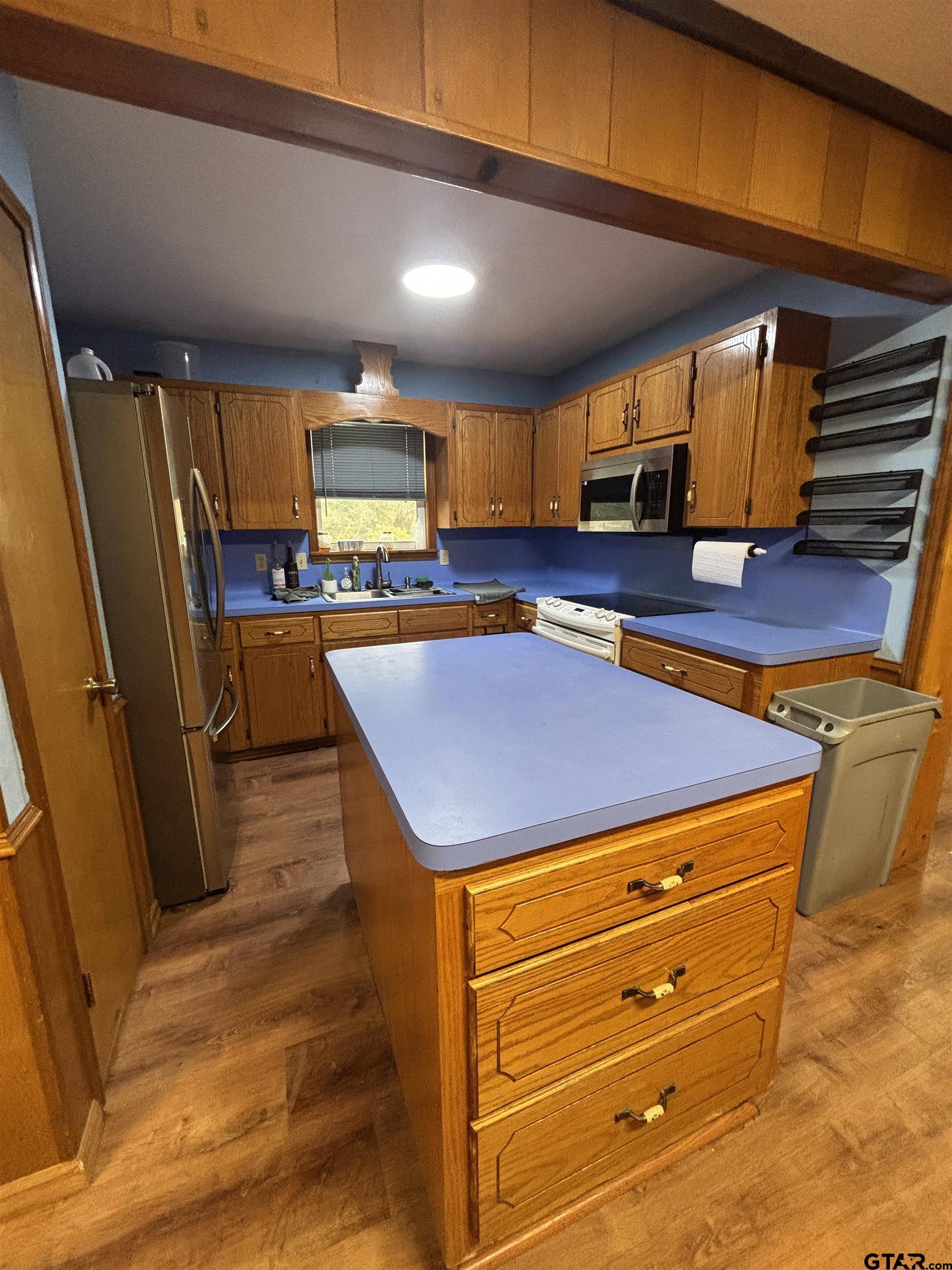 8123 Cherokee Trace Gilmer, TX 75644 - Photo 11 of 26 a room with pool table a window and potted plant