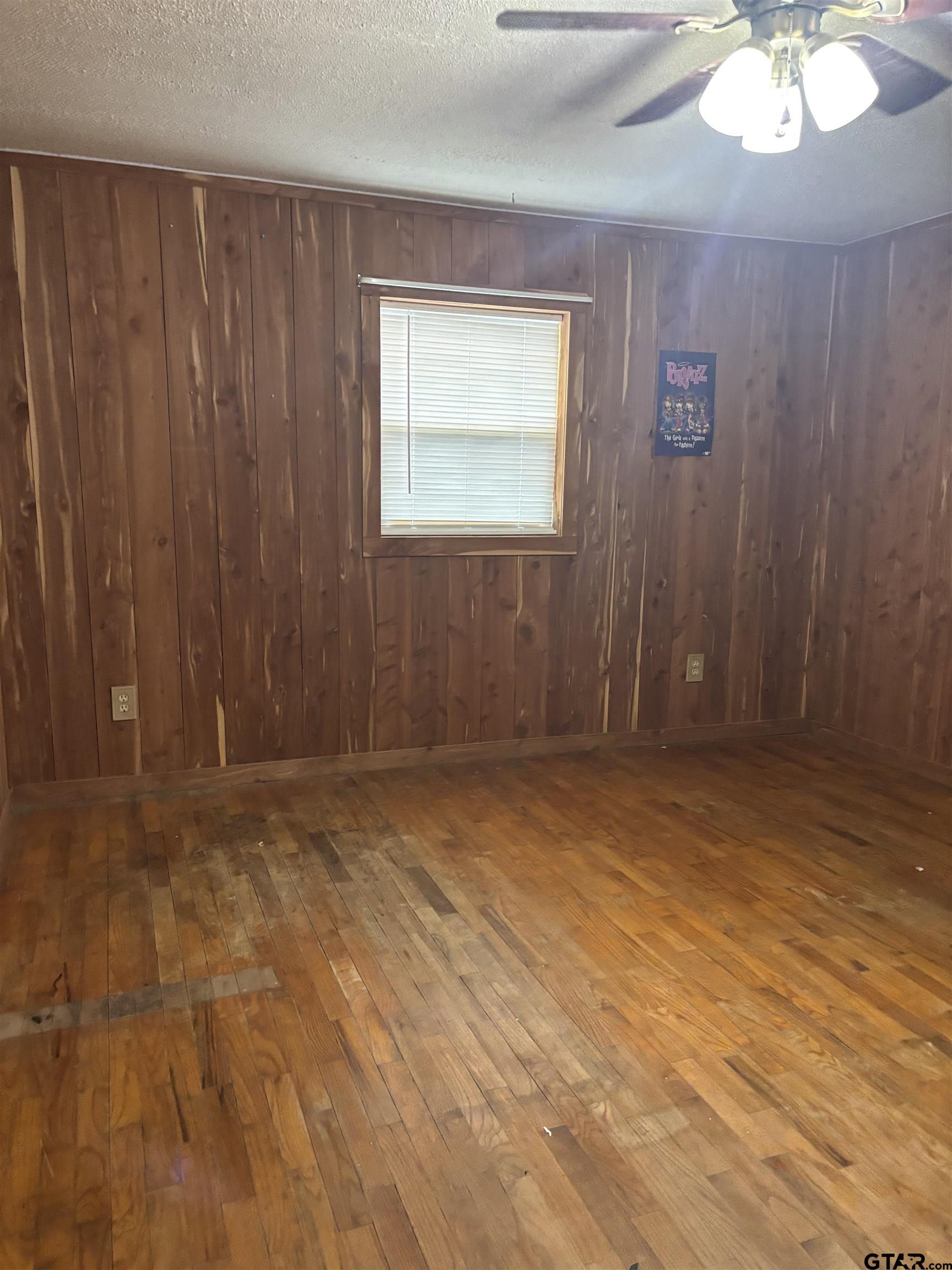 8123 Cherokee Trace Gilmer, TX 75644 - Photo 18 of 26 an empty room with a chandelier fan