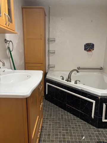 a bathroom with a sink and a bathtub