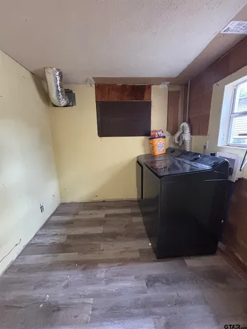 a kitchen with a sink and a mirror