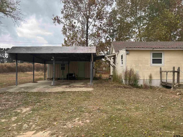 a house with trees in the background