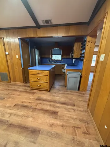 a room with furniture and view of bathroom