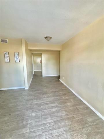 1109 Jackson Street Zapata, TX 78076 - Photo 13 of 30 a view of empty room with wooden floor