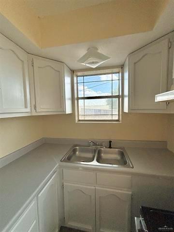 1109 Jackson Street Zapata, TX 78076 - Photo 20 of 30 a kitchen with a sink and cabinets