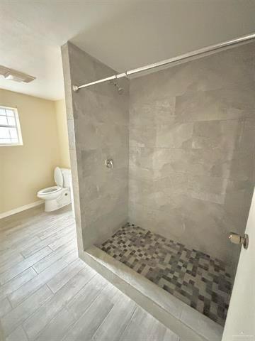 1109 Jackson Street Zapata, TX 78076 - Photo 21 of 30 a bathroom with a shower and a toilet