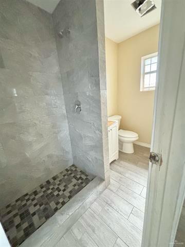 1109 Jackson Street Zapata, TX 78076 - Photo 25 of 30 a bathroom with a sink toilet and shower