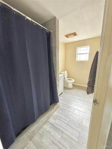 1109 Jackson Street Zapata, TX 78076 - Photo 4 of 30 a bathroom with a sink and a toilet
