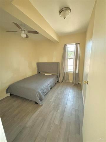 1109 Jackson Street Zapata, TX 78076 - Photo 10 of 30 a view of a room with wooden floor and cabinet