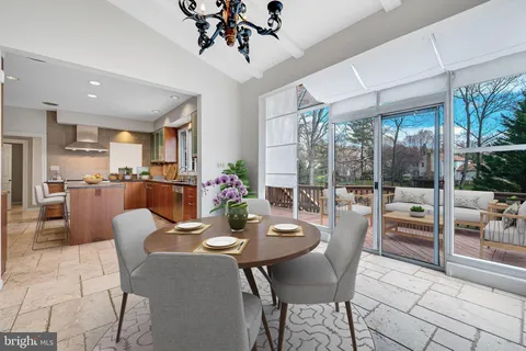a dining room with furniture a livingroom and chandelier