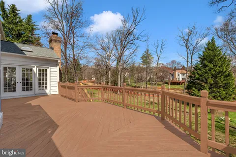 a view of a balcony with trees