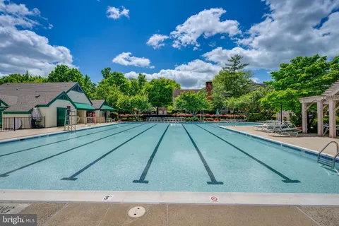 a view of swimming pool with a yard
