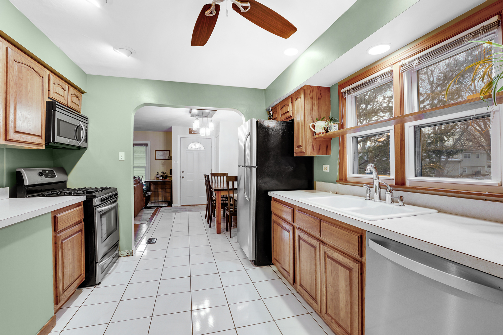 1247 Hickory Road Homewood, IL 60430 - Photo 8 of 22 a kitchen with stainless steel appliances granite countertop a refrigerator a stove and a sink