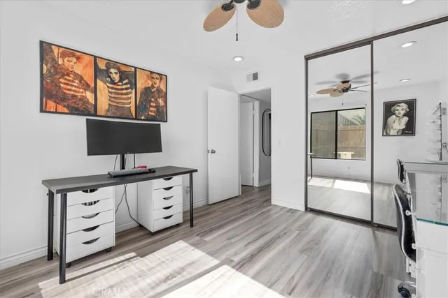 a view of kitchen with furniture and wooden floor