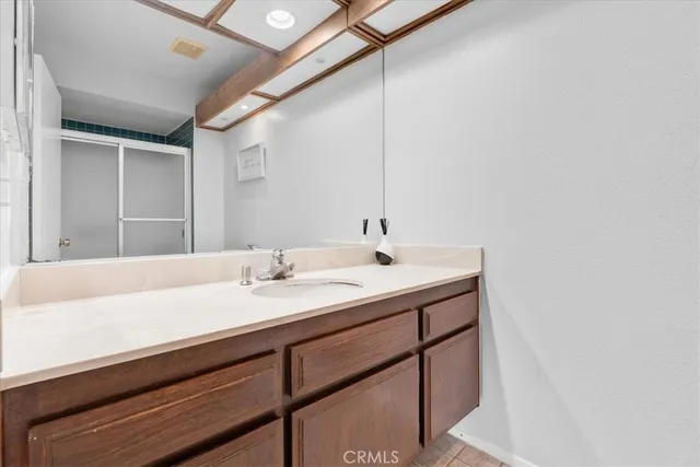 a white toilet sitting next to a shower