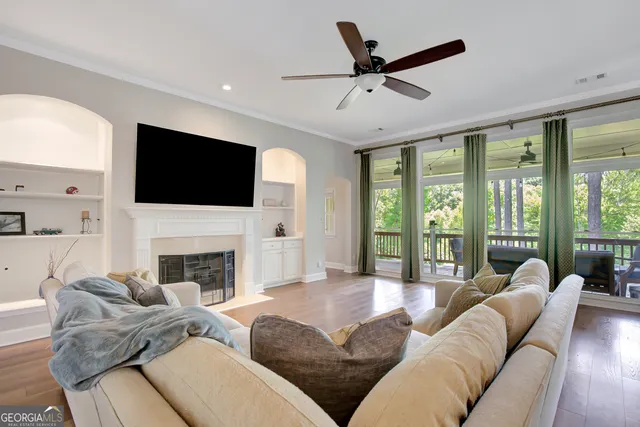 a kitchen with stainless steel appliances granite countertop a sink and a white cabinets
