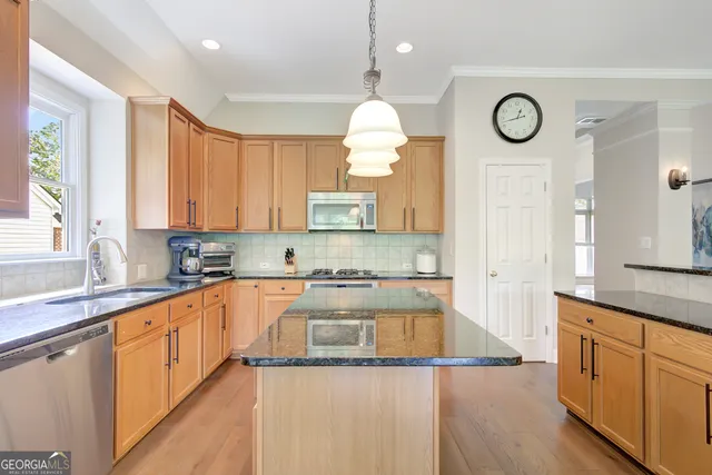 a view of a balcony with chairs and wooden floor