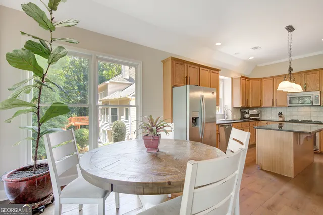 a spacious bedroom with a bed and a flat screen tv