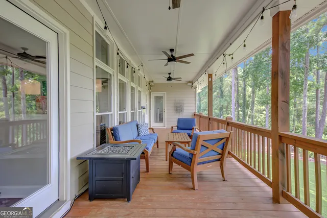 a bathroom with a granite countertop sink a mirror and a shower