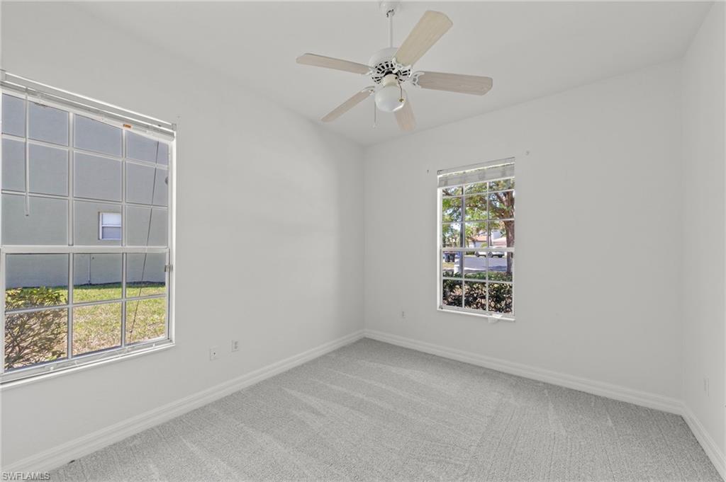 9623 Springlake Circle Estero, FL 33928 - Photo 26 of 47 an empty room with windows and fan
