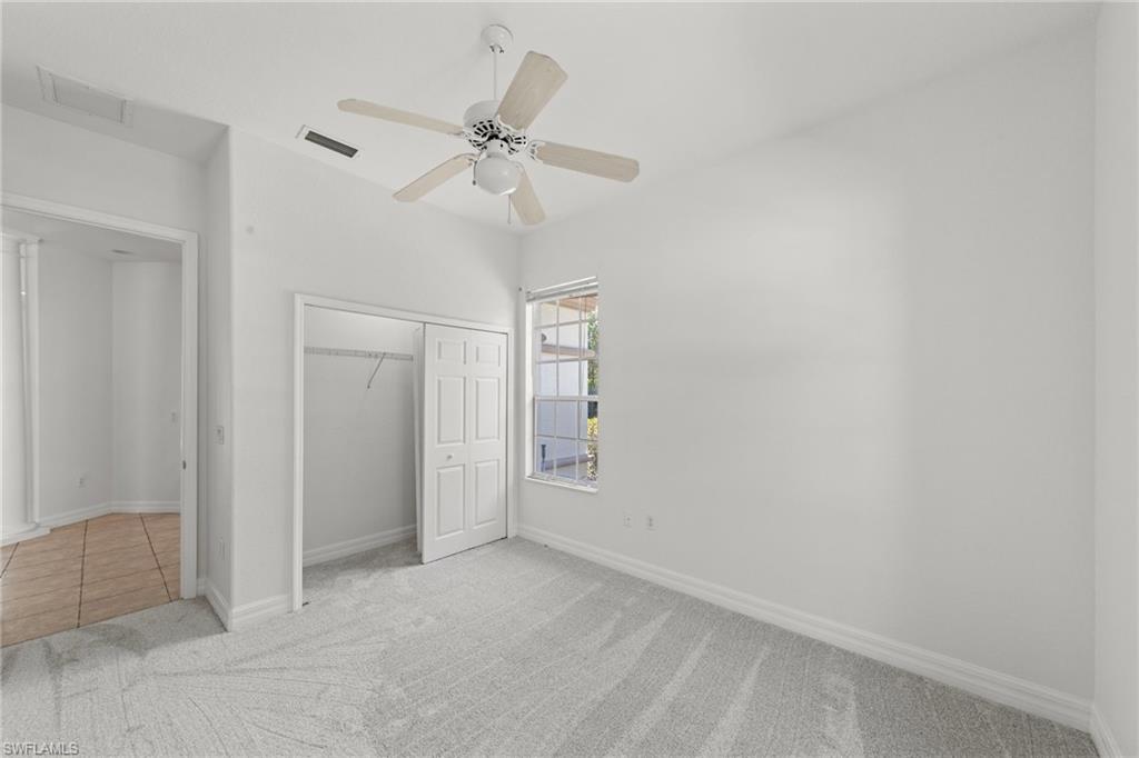 9623 Springlake Circle Estero, FL 33928 - Photo 27 of 47 an empty room with closet and fan