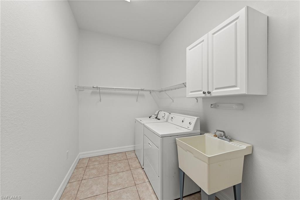9623 Springlake Circle Estero, FL 33928 - Photo 31 of 47 a utility room with sink dryer and washer