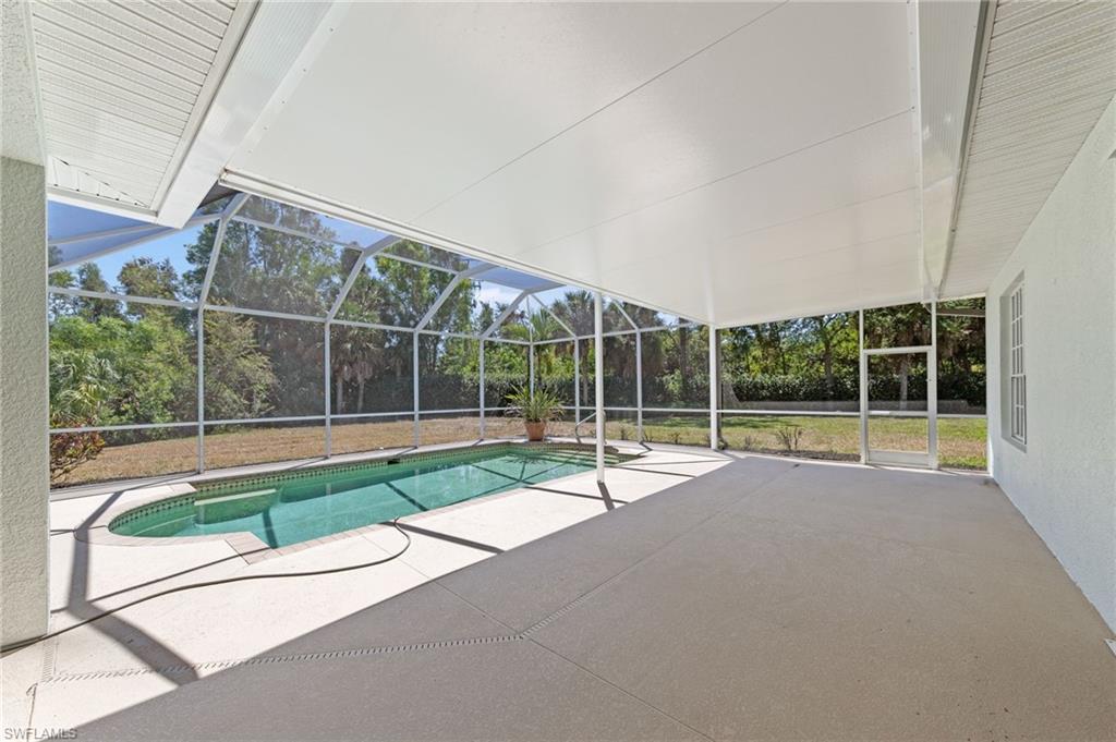 9623 Springlake Circle Estero, FL 33928 - Photo 36 of 47 a view of backyard with swimming pool and outdoor seating