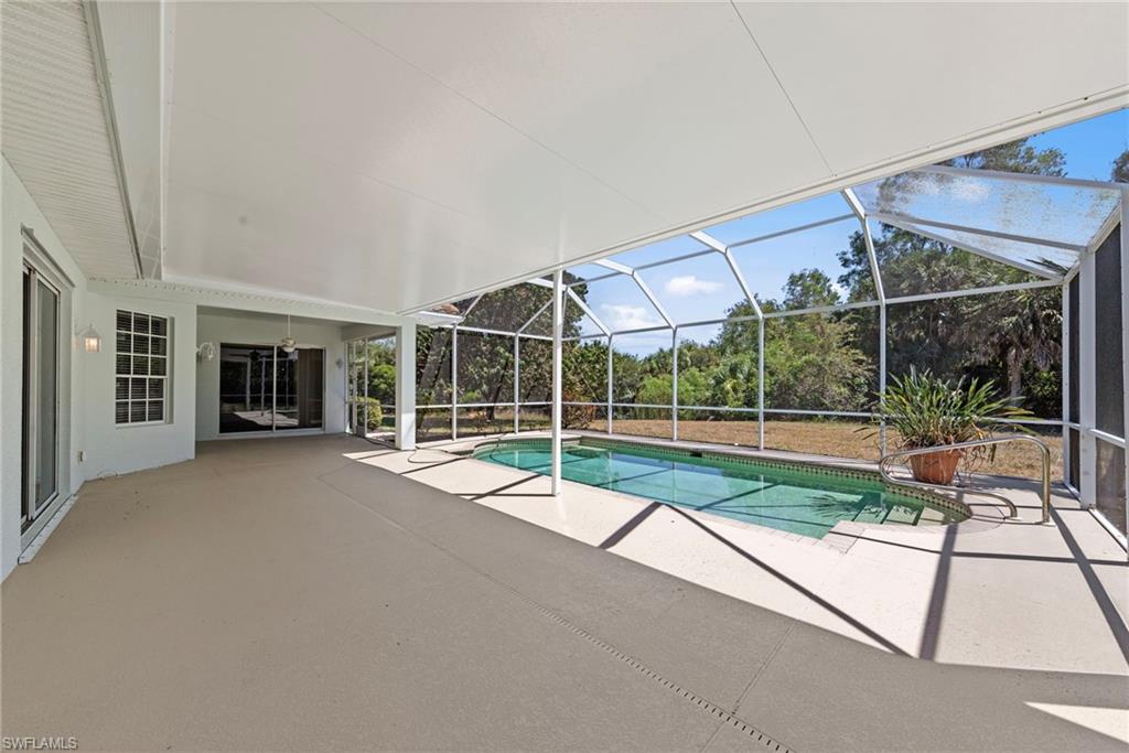 9623 Springlake Circle Estero, FL 33928 - Photo 38 of 47 a view of a house with porch and a yard