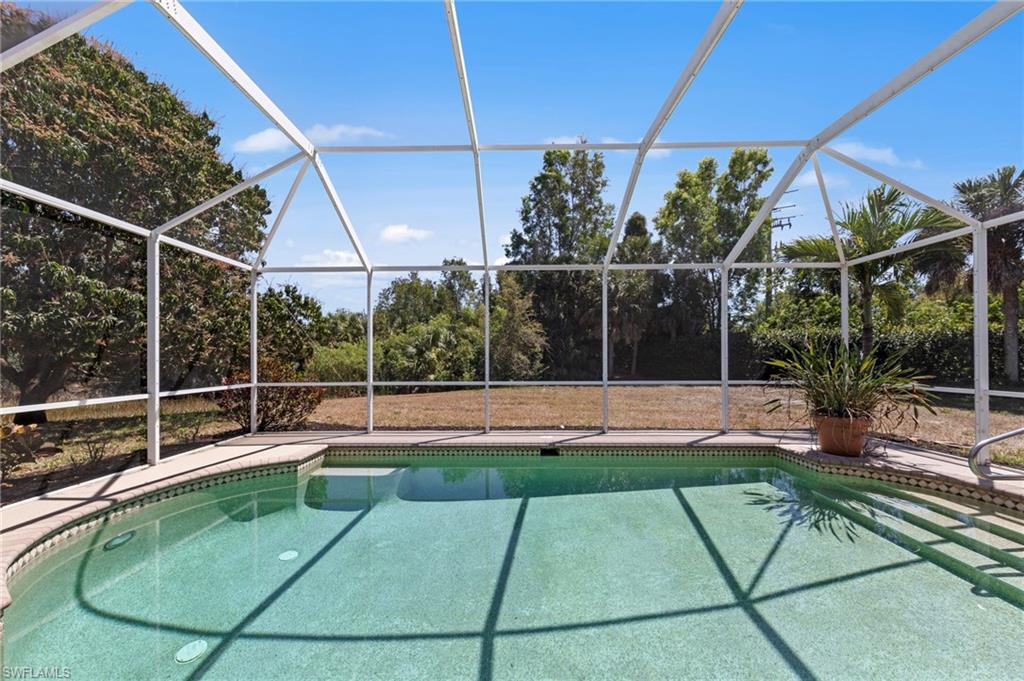 9623 Springlake Circle Estero, FL 33928 - Photo 40 of 47 a view of a backyard with a swimming pool