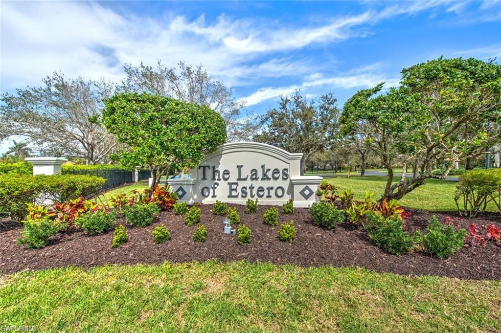 9623 Springlake Circle Estero, FL 33928 - Photo 43 of 47 a sign that is sitting in front of flowers