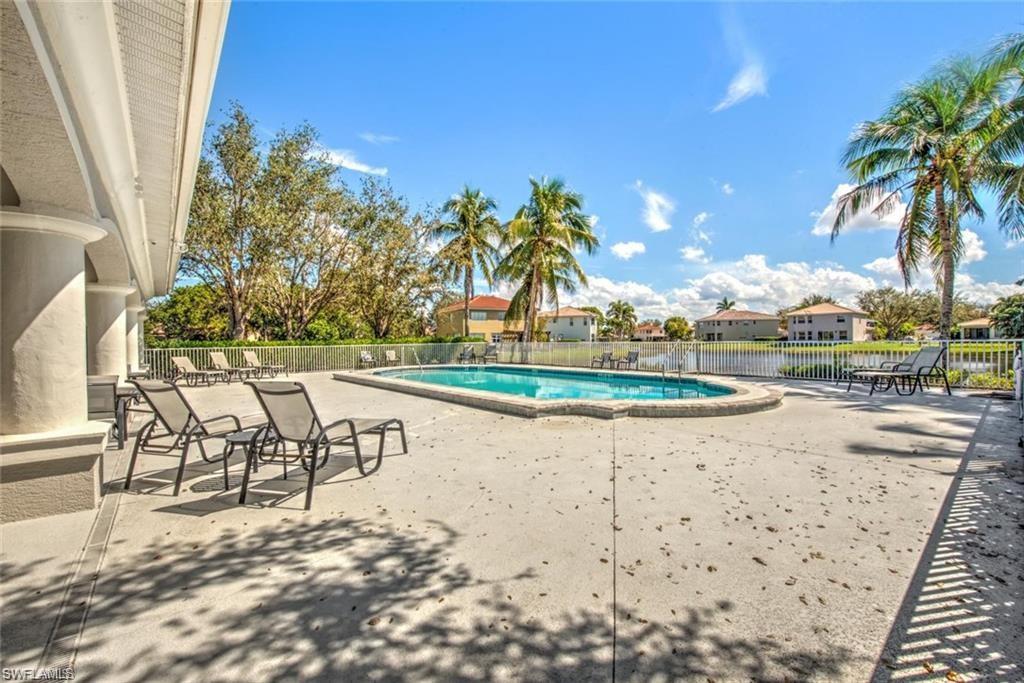 9623 Springlake Circle Estero, FL 33928 - Photo 44 of 47 a view of a swimming pool with an outdoor seating