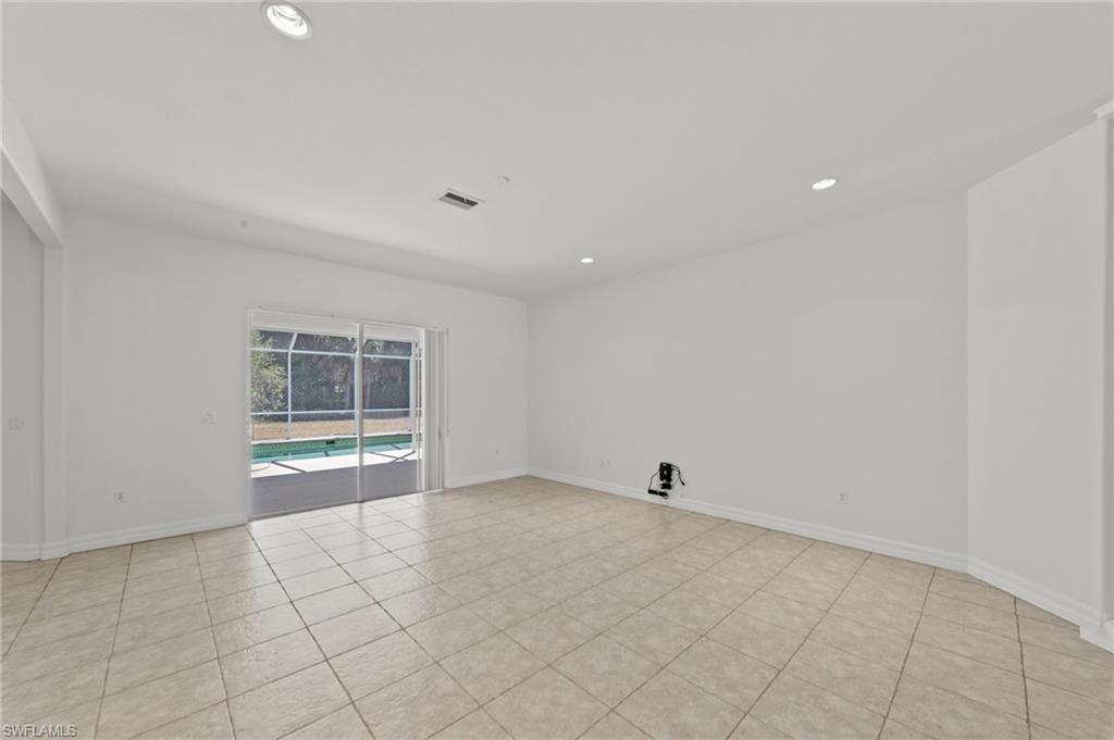 9623 Springlake Circle Estero, FL 33928 - Photo 10 of 47 a view of an empty room with a window