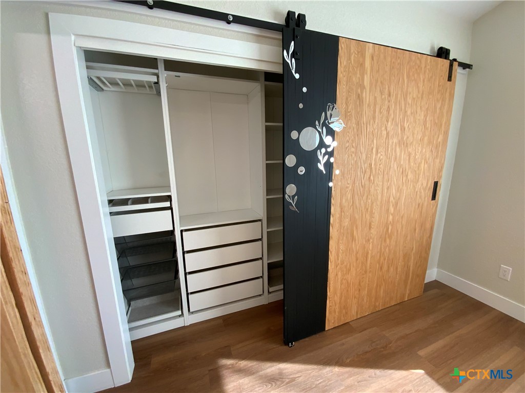4725 Hartrick Bluff Road Temple, TX 76502 - Photo 20 of 27 a view of walk in closet with empty racks