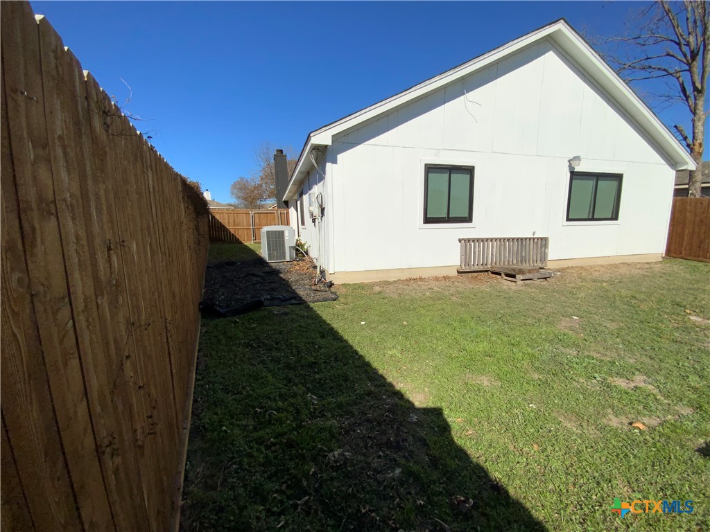4725 Hartrick Bluff Road Temple, TX 76502 - Photo 26 of 27 a view of a backyard with a garden