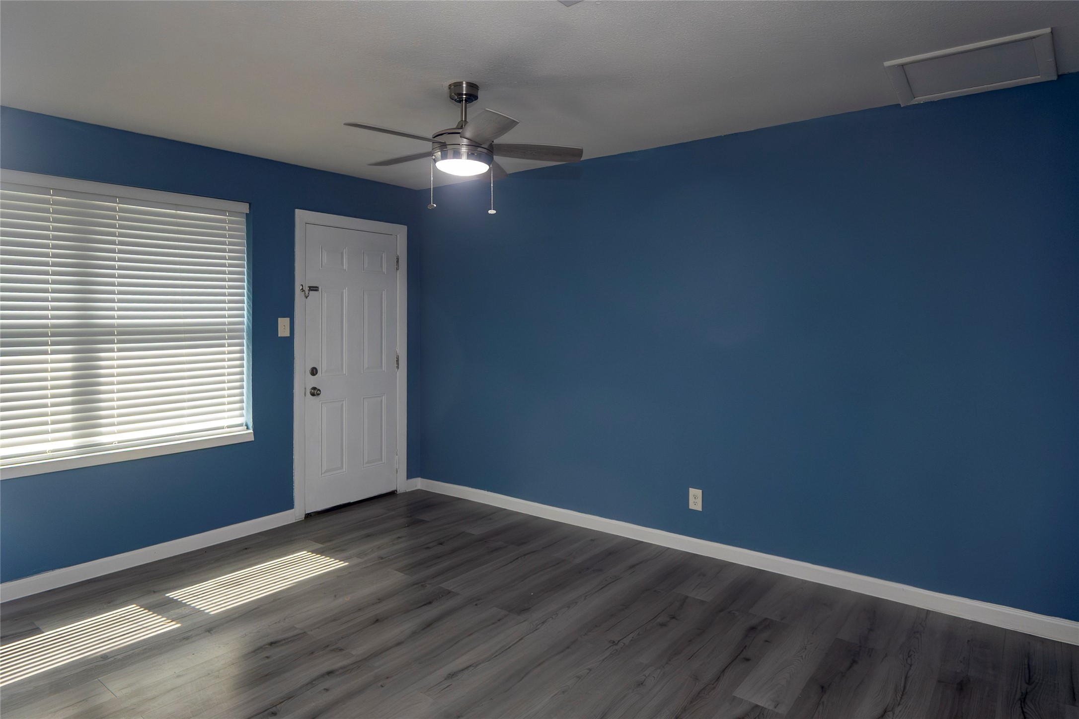 716 Hargest Street, Unit B Prairie View, TX 77445 - Photo 6 of 11 a view of an empty room with wooden floor and a window