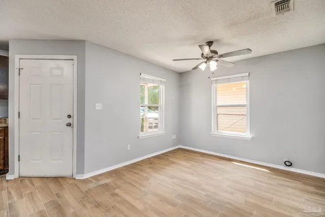 a view of an empty room with a window
