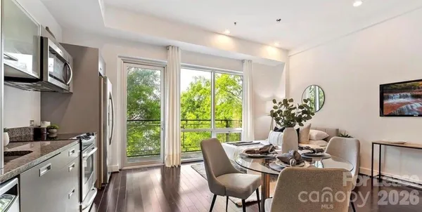 a view of a dining room with furniture window and outside view