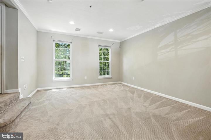 1547 Northern Neck Drive, Unit 201 Vienna, VA 22182 - Photo 12 of 23 an empty room with windows