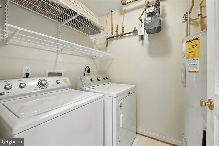 1547 Northern Neck Drive, Unit 201 Vienna, VA 22182 - Photo 13 of 23 a utility room with dryer and washer