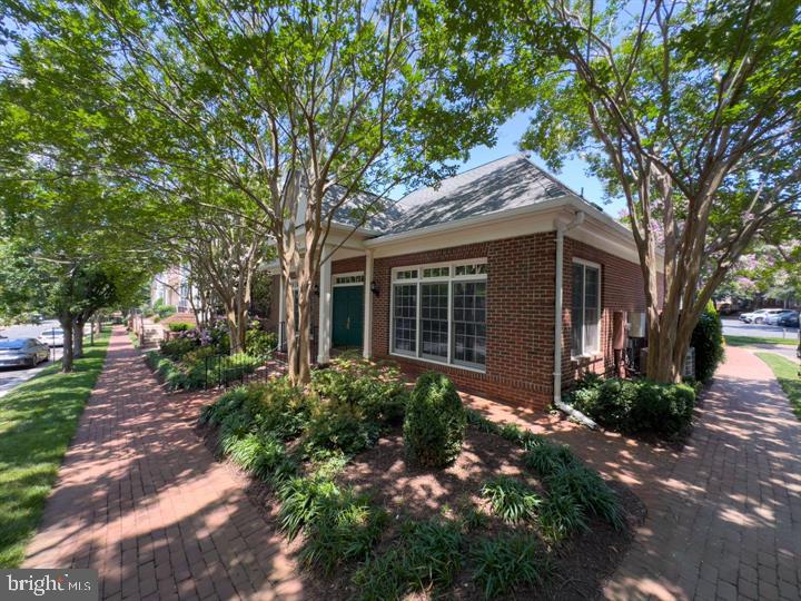 1547 Northern Neck Drive, Unit 201 Vienna, VA 22182 - Photo 21 of 23 a view of a house with a garden