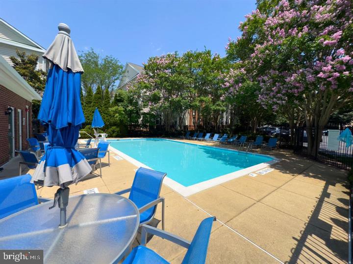 1547 Northern Neck Drive, Unit 201 Vienna, VA 22182 - Photo 22 of 23 a view of an chairs and tables in the patio