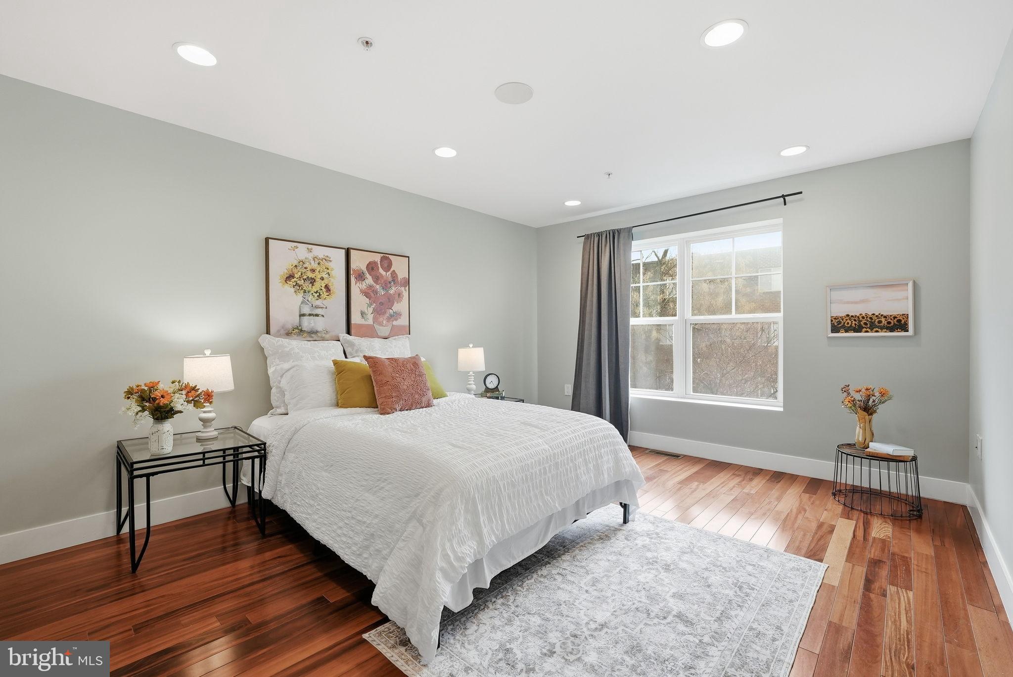 1512 F Street Northeast, Unit 2 Washington, DC 20002 - Photo 17 of 37 Serene bedroom with natural light and warmth.