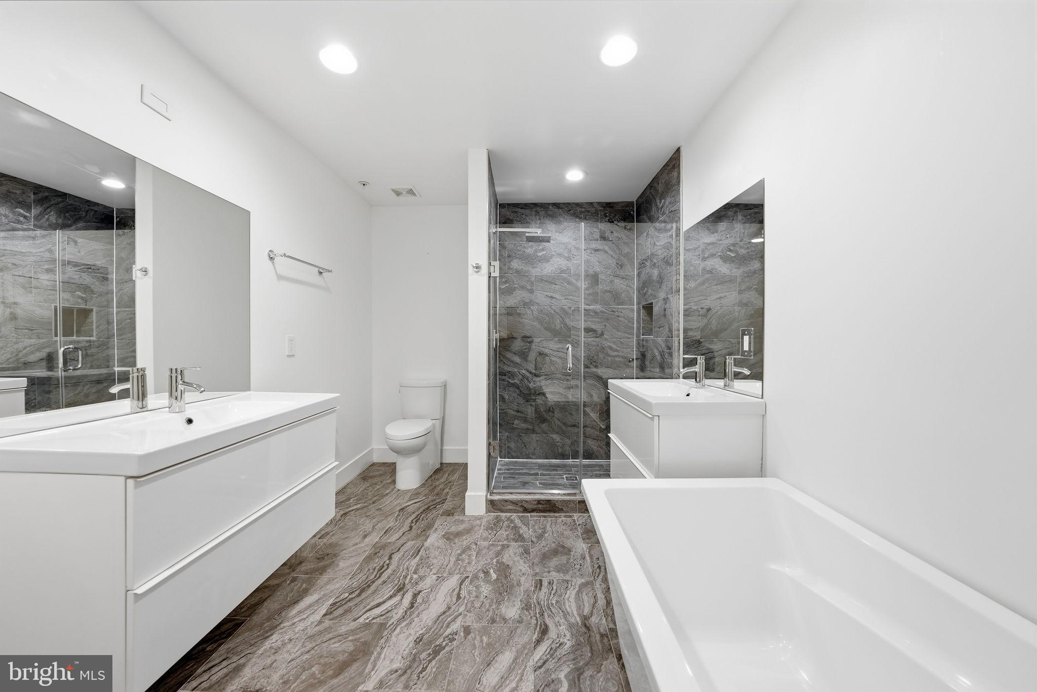 1512 F Street Northeast, Unit 2 Washington, DC 20002 - Photo 18 of 37 Sleek modern bathroom with elegant finishes.