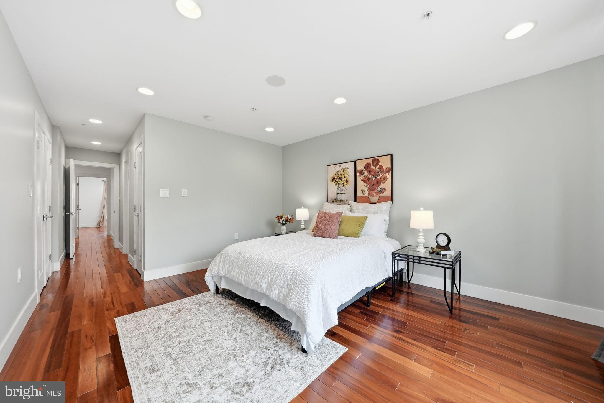 1512 F Street Northeast, Unit 2 Washington, DC 20002 - Photo 19 of 37 Serene bedroom with warm wooden floors.