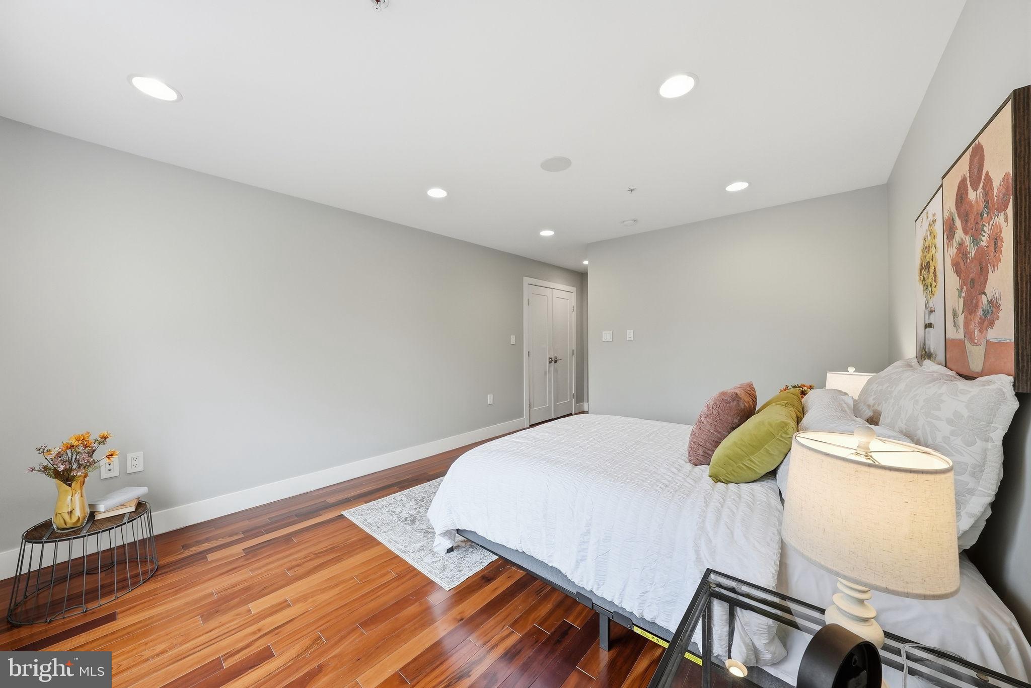 1512 F Street Northeast, Unit 2 Washington, DC 20002 - Photo 21 of 37 Serene bedroom with warm wooden accents.