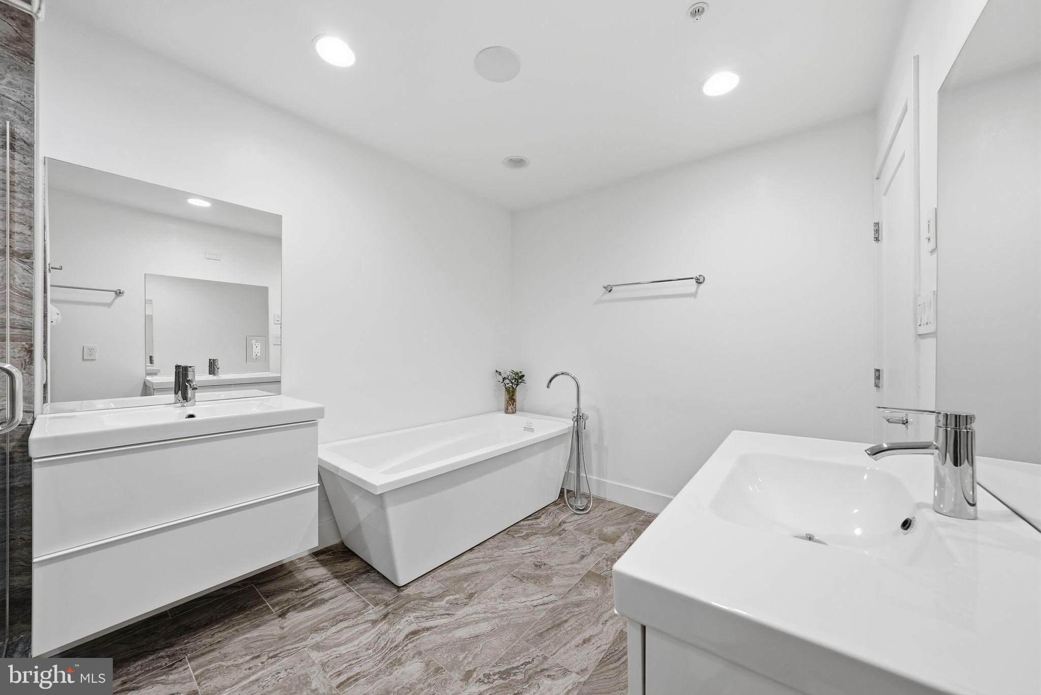1512 F Street Northeast, Unit 2 Washington, DC 20002 - Photo 22 of 37 Sleek modern bathroom with elegant finishes.