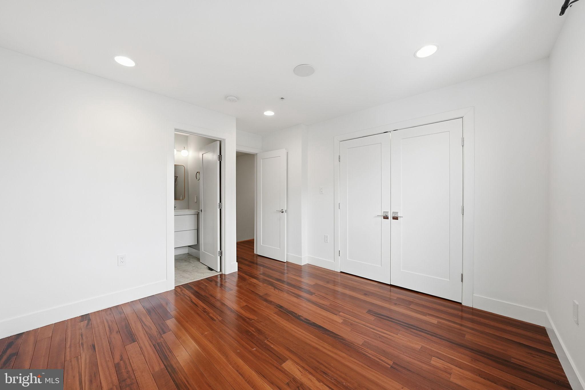 1512 F Street Northeast, Unit 2 Washington, DC 20002 - Photo 28 of 37 Bright and spacious room with elegant flooring.