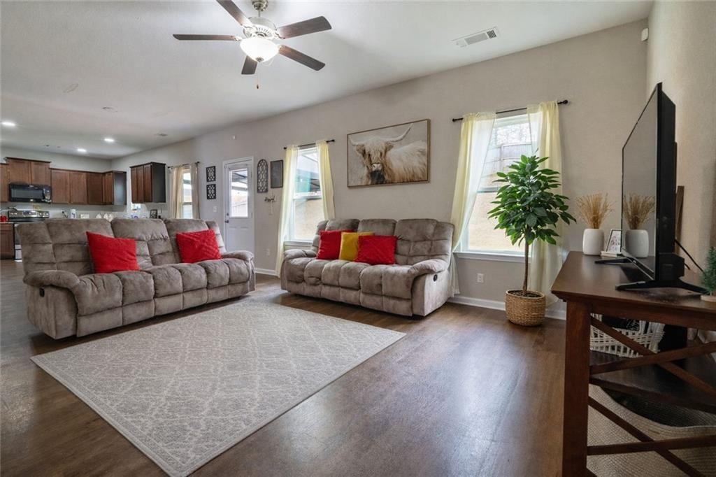 735 Walnut Creek Circle Pendergrass, GA 30567 - Photo 7 of 29 a living room with furniture and a flat screen tv