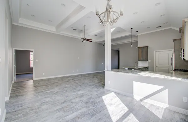 a view of a kitchen with a sink and a refrigerator